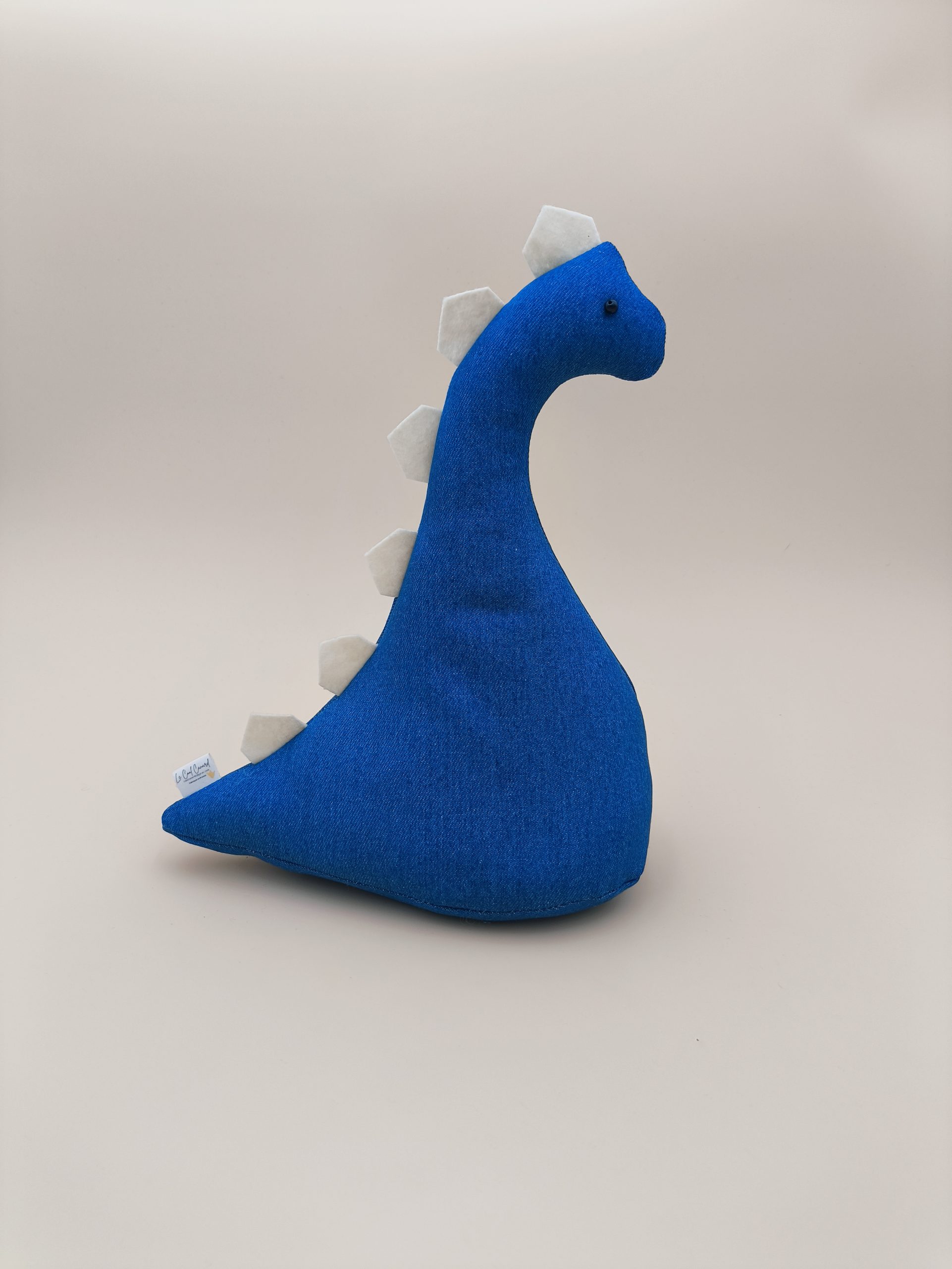 Cale-porte dinosaure - jeans bleu avec plaques blancs