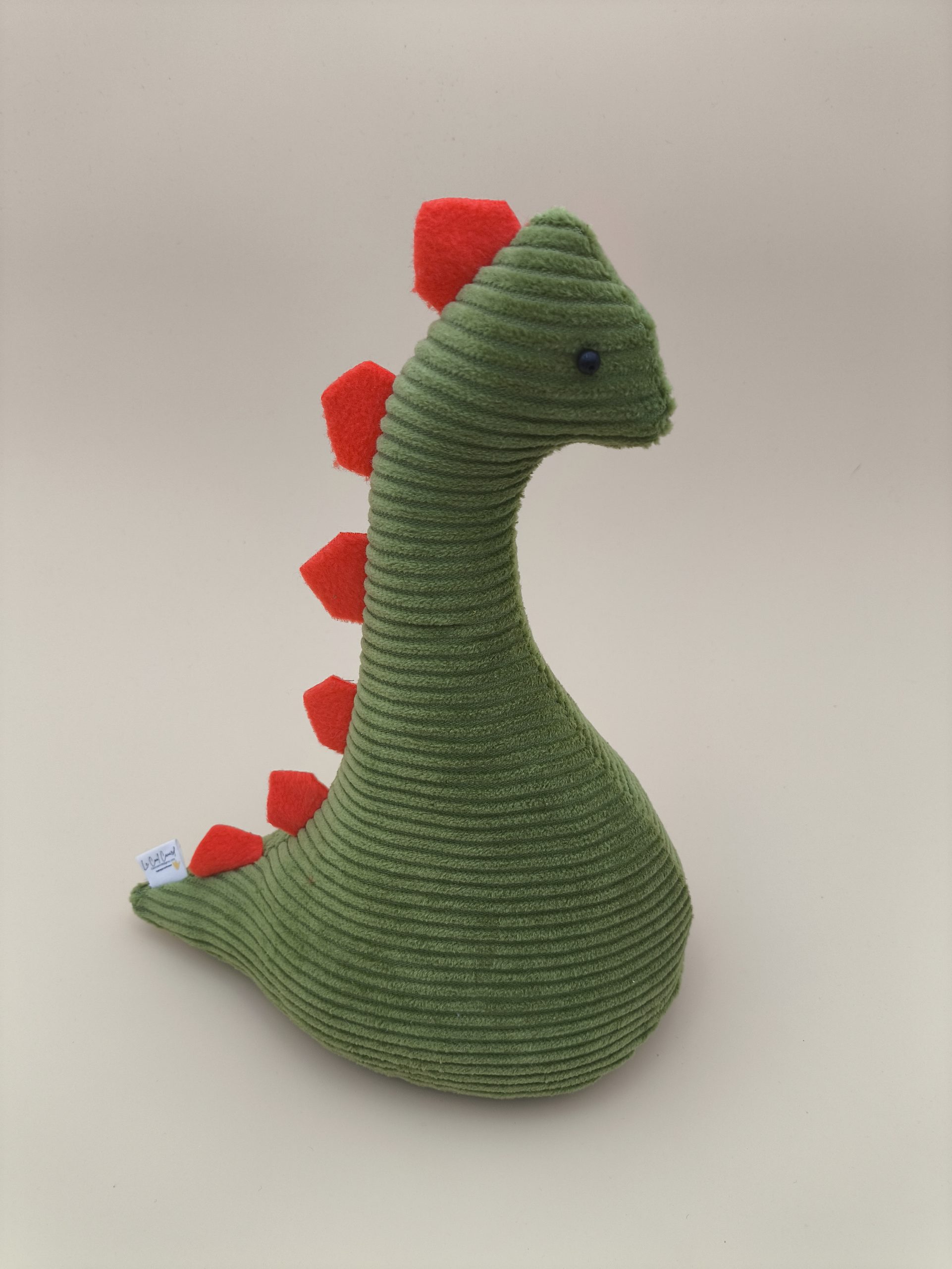 Cale-porte dinosaure - velours cotelé vert avec ses plaques orange – Image 2