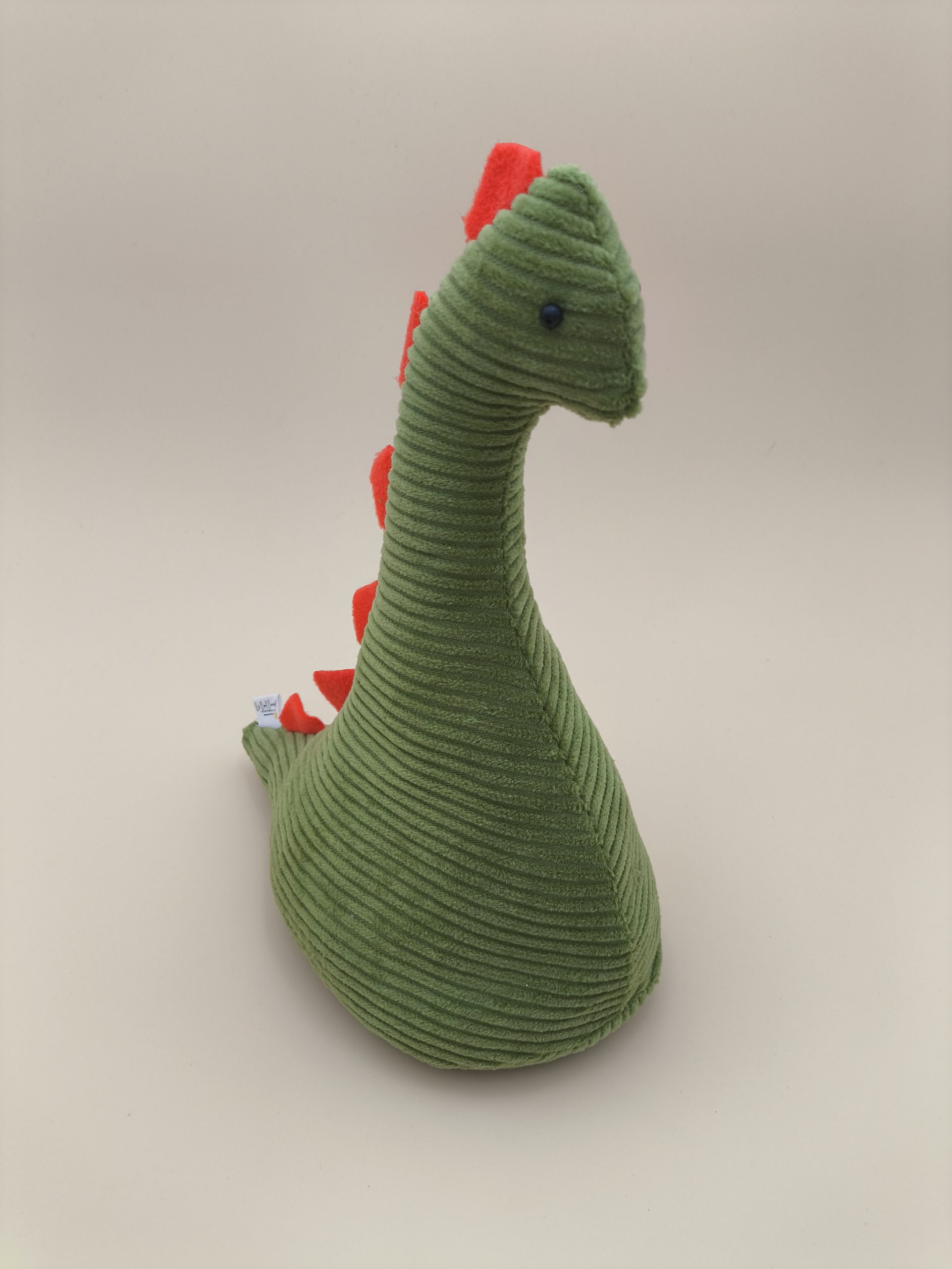 Cale-porte dinosaure - velours cotelé vert avec ses plaques orange – Image 9