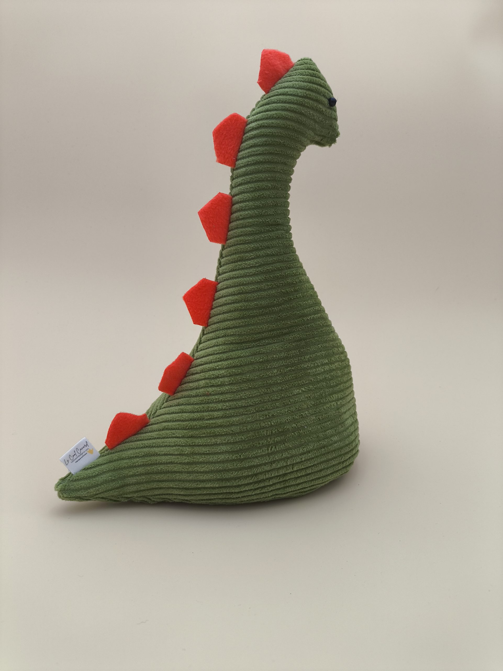 Cale-porte dinosaure - velours cotelé vert avec ses plaques orange – Image 4
