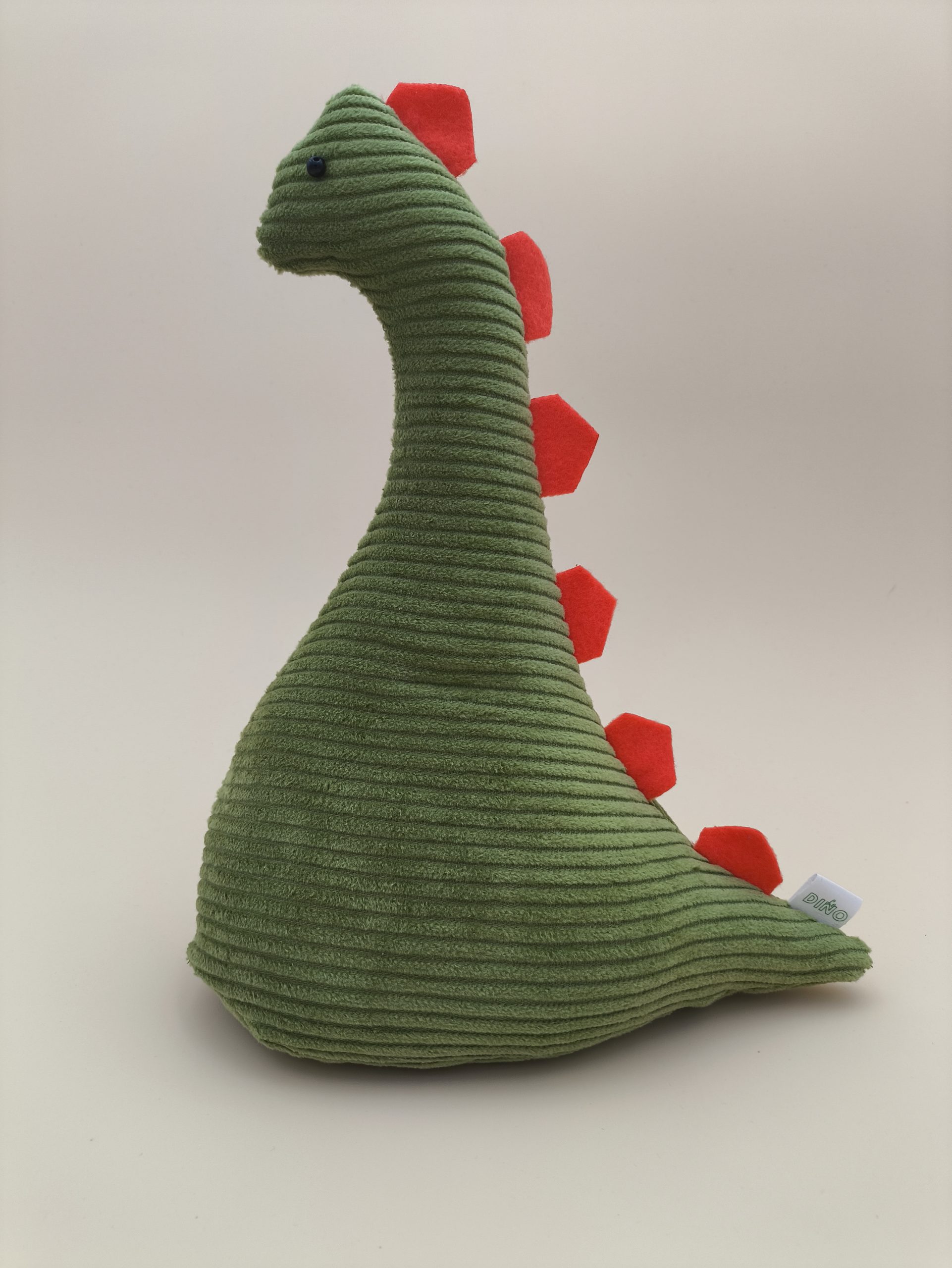 Cale-porte dinosaure - velours cotelé vert avec ses plaques orange – Image 3