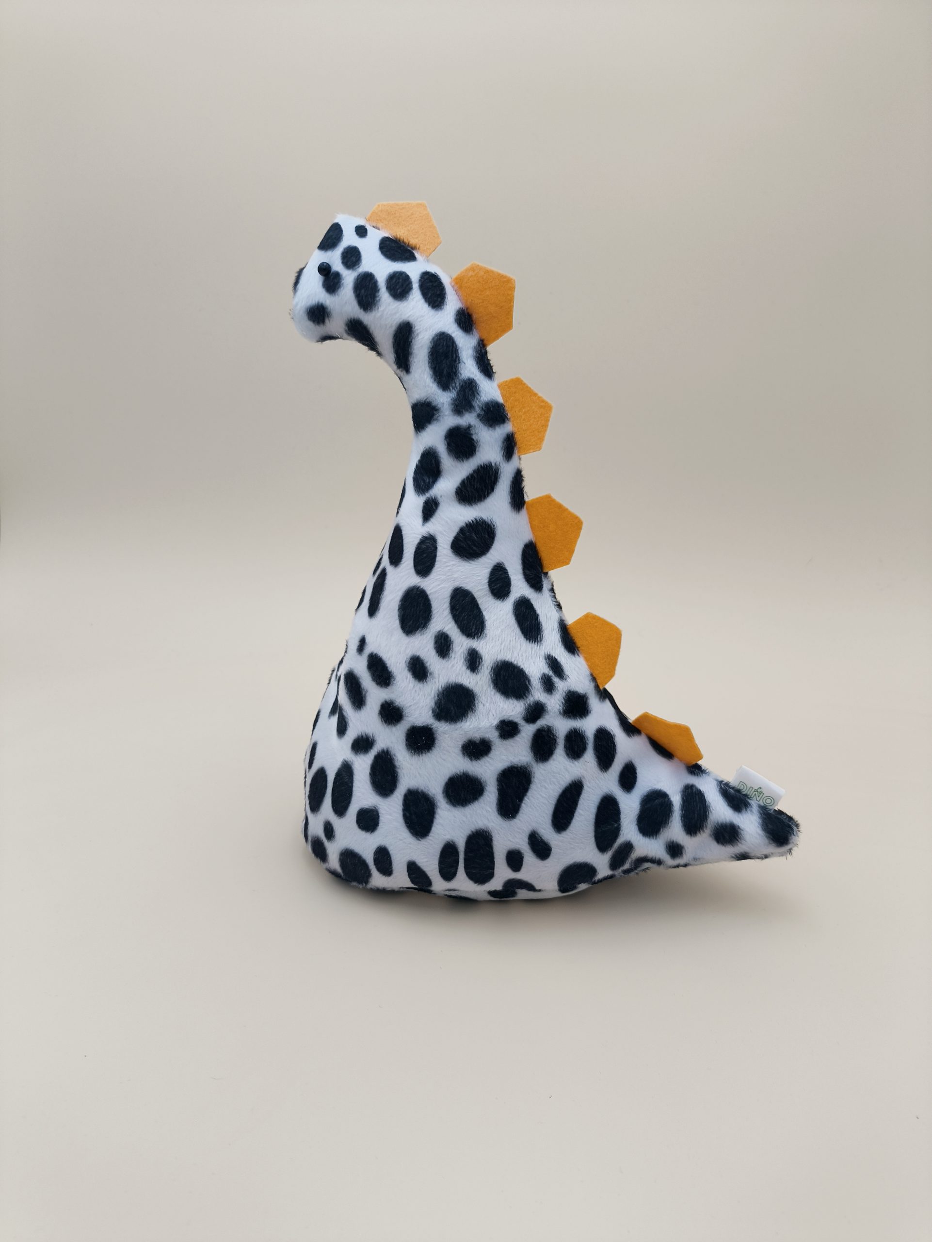 Cale-porte dinosaure - fausse fourrure dalmation avec ses plaques jaune - Image 12