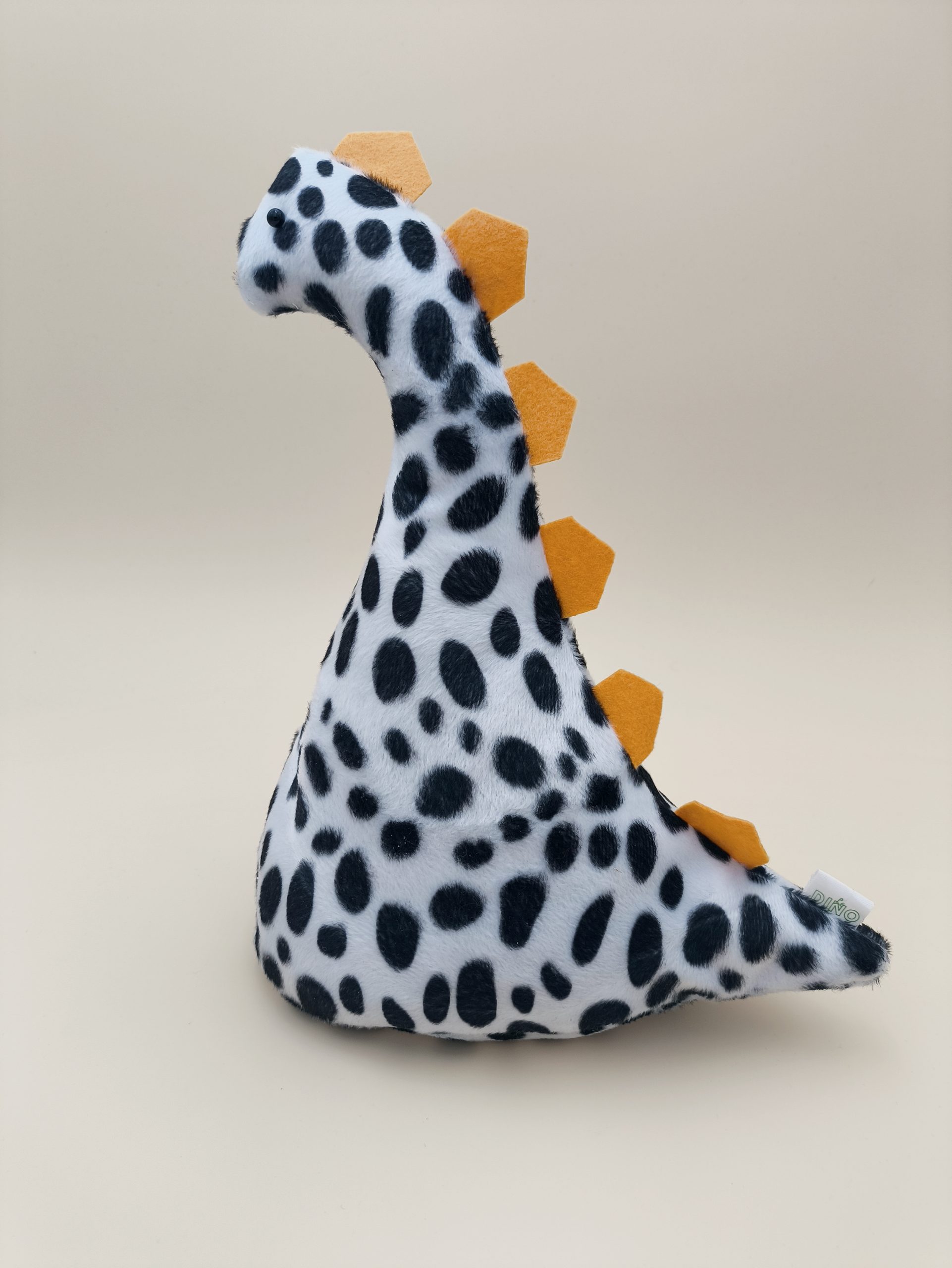 Cale-porte dinosaure - fausse fourrure dalmation avec ses plaques jaune - Image 2